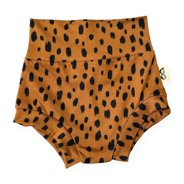 Brown diaper cover with black spotted pattern on a white background