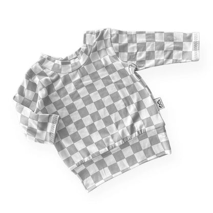 Gray and white checkered shirt on a white background